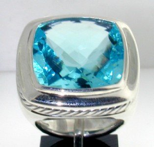 David Yurman Silver Blue Topaz Ring.: David Yurman Silver Blue Topaz Ring. The total ring's weight is 25.2 grams.The size of the Blue Topaz is 20 mm. The size of the ring is 7.5"The measurement of the face of the ring is 25 x 25 mm. Thick