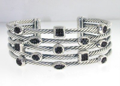 David Yurman Silver, Black Diamond Bangle: David Yurman Silver, Black Diamond Bangle. The total Bangle's weight is 51 grams. The total weight of Black Diamond: 0.87 cts The measurement of the inside bangle is 55 x 46 mm