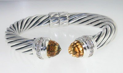 David Yurman silver diamond and lemon citrine bang: David Yurman Silver diamond and lemon citrine bangle Bangle's Weight : 47.5 grams. The size of hematite: 10 mm in diameter. The measurements of the Bangle are 74x64mm, thickness is 9.5 mm. There is St