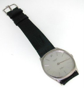 Rolex cellini original buckle 18k WG leather strap: Rolex cellini original buckle 18k WG leather strapwatch The total watch's weight is 37.4 grams. The measurements of watch head is 36x31 mm and 4 mm thick. The length of watch: 7" water Resistant swiss