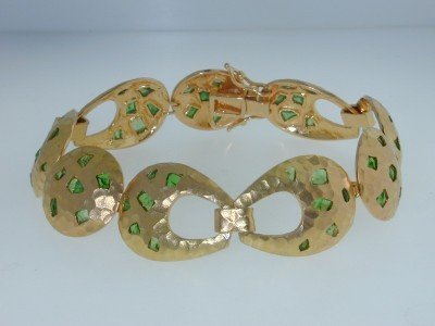 Lunia 18K Yellow Gold, Tsavorite Bracelet: Lunia 18K Yellow Gold,Tsavorite Bracelet The total bracelet's weight is 33.1 grams. The total weight of Tsavorite: 3.8 cts, approximately. The bracelet width are 17 mm. The length of the bracelet is 7