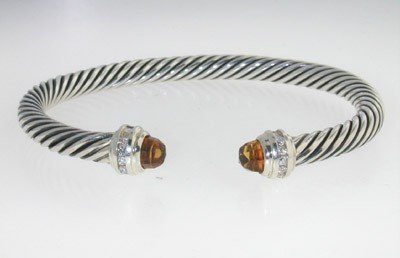 David Yurman Silver, Citrine & Diamond Bangle.: David Yurman Silver, Citrine & Diamond Bangle.The total Bangle's weight is 24.9 grams.The total weight of diamond: 0.20 cts. H color SI clarity.The size of Citrine: 4 mm .The measurement of the inside