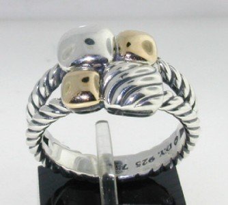 David Yurman 18K Yellow Gold, Silver Ring: David Yurman 18K Yellow Gold, Silver Ring. The total ring's weight is 6.7 grams. The size of the ring is 6.75"