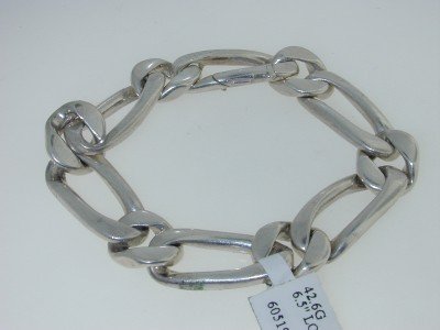 Craig Drake Silver Bracelet: The is a beautiful Craig Drake Silver Bracelet.The total bracelet's weight is 42.6 grams. The bracelet is 6.5" long. The size of the bracelet is 12 mm in wide.