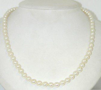 Mikimoto 18K Yellow Gold Pearl Necklace: Mikimoto 18K Yellow Gold Pearl Necklace The weight of the necklace is 25.7 grams. The necklace is 17.25" long. The size of pearl: 5 mm, graduated.