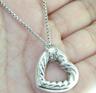 David Yurman Silver Necklace: David Yurman Silver Necklace. The total weight of Necklace is 18.4 grams. The Chain is 19" long. The size of the pendant is 25x25 mm.