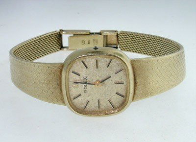 Rolex 14K Yellow Gold Wrist Watch: Rolex 14K Yellow Gold Wrist Watch.The total watch's weight is 30.7 grams. The measurements of watch head is 20 x 20 mm and 5 mm thick.The length of watch: 5.5".swiss made.Water Resistant.Chain is 9 mm