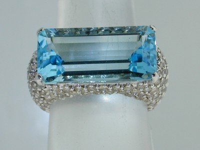 Salavetti 18K White Gold Blue Topaz Diamond Ring.: Salavetti 18K White Gold Blue Topaz Cognac color Diamond Ring. The total ring's weight is 11.1 grams.The total weight of the Cognac Color diamonds are 4.07 cts. approxmiately, VS clarity.The size of t