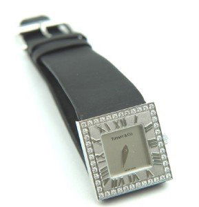 Tiffany & Co 18K Gold, Diamond, Atlas Cocktail Wat: Tiffany & Co 18K White Gold, Diamond, Black Satin - finish Strap & Atlas Cocktail Watch.Watch's Weight : 29 grams.Total weight of diamond: 0.24 cts, G color, VS clarity.The length of watch: 6"Water re
