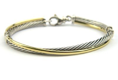 David Yurman 18K Yellow Gold / Silver Bangle!: David Yurman 18K Yellow Gold / Silver Bangle! Bangle's Weight : 15 grams. The measurements of the Bangle: 42 x 50 mm and the thickness is 2 mm. There is Stamp D.Y, 750, 925 on it.