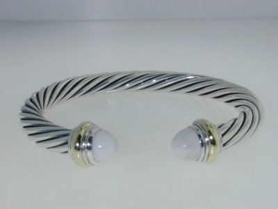 David Yurman Silver/ 14K Gold, White Coral Bangle.: David Yurman Silver/14K Yellow Gold, White Coral Bangle. The total Bangle's weight is 33.1 grams. The size of White Coral : 8 mm The measurement of the inside bangle is 57x 47 mm, Thickness: 7 mm.