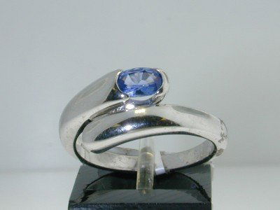 Bvlgari 18K White Gold, Sapphire Ring.: Bvlgari 18K White Gold Sapphire Ring. The total ring's weight is 6.0 grams. The size of the Sapphire is 5 x 4 mm. The size of the ring is 6.75". The measurement of the ring on the surface is 9 mm in w