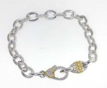 Judith Ripka 18K Yellow Gold/Silver, Diamond Brace: Judith Ripka 18K Yellow Gold/ Silver & Diamond Bracelet. The total bracelet's weight is 25.5 grams. The total diamond weight: 0.03 pts. H color, VS clarity. The bracelet is 7.25" long. The size of the