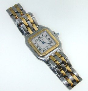 Cartier 18K Yellow gold, Stainless Steel Watch: Cartier 18K Yellow Gold, Stainless Steel Watch with extra link. The total watch's weight is 44.3 grams. The measurements of watch head is 20 x 20 mm and 5 mm thick. The length of watch: 5". water Resi