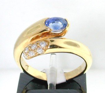 Bvlgari 18K Yellow Gold, Sapphire & Diamond Ring.: Bvlgari 18K Yellow Gold, Sapphire & Diamond Ring. The total ring's weight is 5.6 grams. The size of the Sapphire is 5 x 3 mm. Total weight: 0.5 cts. Total weight of diamond: 20 pts, G color, VS clarit