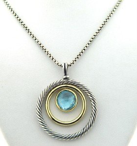 David Yurman 18K Gold / Silver, Blue Topaz Necklac: David Yurman 18K Yellow Gold / Silver, Blue Topaz Necklace. The total weight of Necklace is 13.2 grams. The measurements of Blue Topaz: 9 mm. The size of the pendant is 37 x 29 mm, Thickness is 2 mm. 