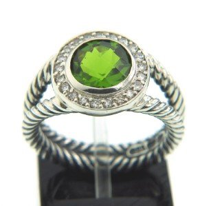 David Yurman Silver Peridot Diamond Ring.: David Yurman Silver Peridot Diamond Ring. The total ring's weight is 6.2 grams. The total weight of the diamond is 0.21 cts approximately, I color SI clarity. The size of the Peridot is 8 x 8 mm. The 