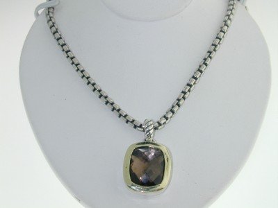 David Yurman 18K Gold, Silver, Smoky Topaz Necklace: David Yurman 18K Yellow Gold, Silver, Smoky Topaz Necklace. The total weight of Necklace is 17.8 grams. The size of the Smoky Topaz is 10 x 8 mm in diameter. The size of the pendant is 17x12 mm, Thick