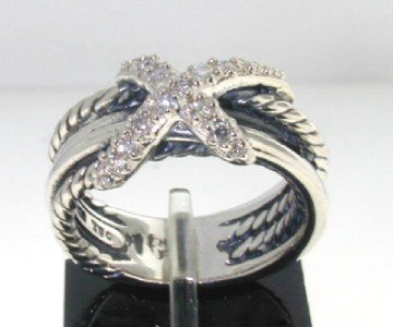 David Yurman Silver, Diamond Ring: David Yurman Silver,Diamond Ring. The total ring's weight is 5.5 grams. The total weight of diamond is 0.07 pts. approximately , I color SI clarity. The size of the ring's surface is 10 x 8 mm. The si