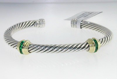 David Yurman Silver/18K Yellow Gold, Emerald Bangl: David Yurman Silver/18K Yellow Gold, Emerald Bangle. The total Bangle's weight is 27.7 grams. The total Emerald weight: 0.4 cts. The bangle size is 48 x 42 mm. 4 mm in thickness.