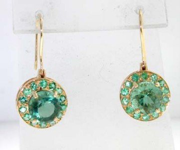 14K Yellow Gold Tsavorite and Green Tourmaline Ear: 14K Yellow Gold Tsavorite and Green Tourmaline Earrings. The total earring's weight is 5.1 grams. The size of Green Tourmaline: 7 x 7mm. Total weight of Tsavorite: 0.56cts. The size of earring: 27 x 1
