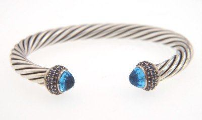 David Yurman Silver, Blue Topaz & Sapphire Bangle.: David Yurman Silver, Blue Topaz & Sapphire Bangle. The total Bangle's weight is 32.1 grams. The total weight of Sapphire: 1 cts. The size of blue topaz: 6 mm. The measurement of the inside bangle is 5