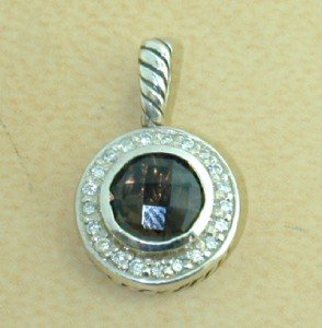 David Yurman Silver Smoky Topaz & Diamond Pendant: David Yurman Silver Smoky Topaz & Diamond Pendant. The total Pendant's weight is 3.2 grams. The total weight of diamonds is 0.23 cts. approximately I and SI clarity. The size of the Smoky Topaz is 7 m