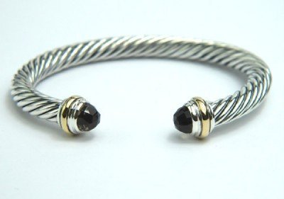 David Yurman Silver, 14K Yellow Gold, Smoky Topaz : David Yurman Silver, 14K Yellow Gold, Smoky Topaz Bangle. The total Bangle's weight is 39.4 grams. The size of smoky topaz: 6 mm. The measurement of the inside bangle is 45 x 56 mm, Thickness: 6 mm.