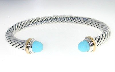 David Yurman Silver,14K Gold,Turquoise Bangle.: David Yurman Silver, 14K Yellow Gold,Turquoise Bangle. The total Bangle's weight is 38.6 grams. The size of Turquoise: 7 mm. The measurement of the inside bangle is 60 x 49 mm, Thickness: 6 mm.