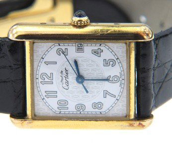 Must de Cartier Silver, Leather Strap Watch.: Must de Cartier Silver, Leather Strap Watch With Original Cartier Buckle Watch's Weight : 39.5 grams. The measurements of watch head: 24 x 24 mm Swiss made Water Resistant The length of watch: 6.75"