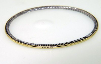 David Yurman 18k Yellow Gold & Silver Bangle: David Yurman 18k Yellow Gold & Silver Bangle Bangle's Weight : 11 grams. The measurements of the Bangle: 65 X 65 mm and the thickness is 2 mm. There is Stamp D.Y, 750, 925 on it.