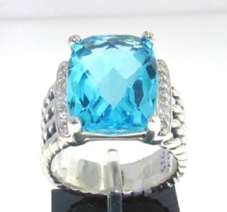 David Yurman Silver Blue Topaz Diamond Ring: This is a Wonderful David Yurman Silver Blue Topaz Diamond Ring. The total ring's weight is 9.9 grams. The total diamond weight is 0.25 ct ,approxmiately. I color SI clarity. The size of Blue Topaz is