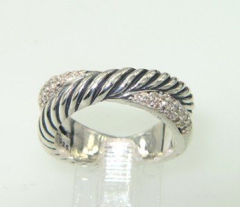 David Yurman Silver, Diamond Ring: David Yurman Silver, Diamond Ring. The total ring's weight is 9.4 grams. The total weight of diamond is 0.24 cts. approximately , I color SI clarity. The size of the ring is 7.