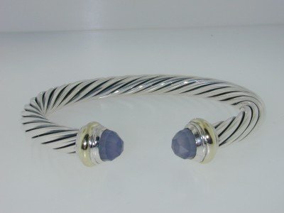 David Yurman Silver, 14K Yellow Gold Chalcedony Bangle: David Yurman Silver & 14K Yellow Gold, Chalcedony Bangle. Bangle's Weight :33.3 grams. The size of Chalcedony : 8 x5 mm. The measurements of the Inside Bangle are 55 x 45 mm and the thickness is 7 mm.