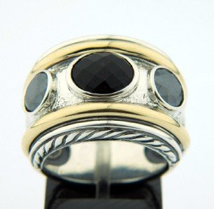 David Yurman Silver/18K Gold, Onyx & Hematite Ring: David Yurman Silver / 18K Yellow Gold, Onyx & Hematite Ring. The total ring's weight is 17.7 grams. The size of Onyx 5 x 9 mm. The size of Hematite 6 x 6 mm. The size of the ring is 7.5.