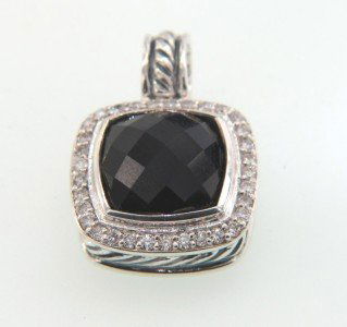 David Yurman Silver & 18K Gold Onyx Diamond Pendan: David Yurman Silver & 18K Gold Onyx Diamond Pendant. The total Pendant's weight is 6.5 grams. The total weight of diamonds is 40 Pts. approximately I and SI clarity. The size of the Onyx is 10 x 10 mm