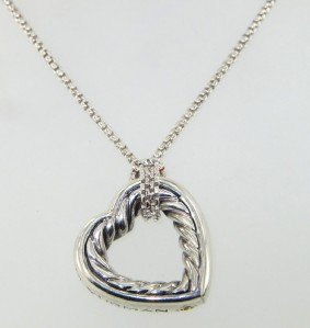 David Yurman Silver Necklace.: David Yurman Silver Necklace. The total weight of Necklace is 18 grams. The size of the pendant is 23 x 23 mm. The length of the necklace is 16.25" inches long.