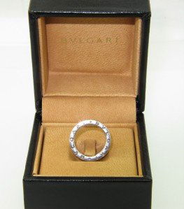 Bvlgari 18K White Gold Ring: Bvlgari 18K White Gold Ring With Original Bvlgari Box The total ring's weight is 9.3 grams. The measurement on the sureface of the ring's face is 7 mm wide. The size of the ring is 5.25