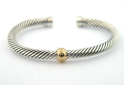 David Yurman 14K Yellow Gold & Silver Bangle!: David Yurman 14K Yellow Gold & Silver Bangle! Bangle's Weight : 29.2 grams. The measurements of the Bangle : 50 x 39 mm and the thickness is 4 mm. There is Stamp D.Y, 585, 925 on it.