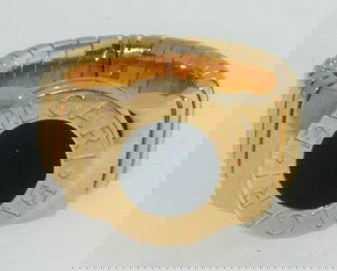Bvlgari 18K Yellow Gold Onyx Ring.: Bvlgari 18K Yellow Gold Onyx Ring.The total Ring's weight is 18.7 grams.The ring face is 13 mm wide.Ring size is 5.25