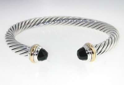 David Yurman Silver /14K Gold, Onyx Bangle.: David Yurman Silver/14K Yellow Gold, Onyx Bangle. The total Bangle's weight is 39.3 grams. The size of Onyx: 6 mm. The measurement of the inside bangle is 55 x 45 mm, Thickness: 6 mm.