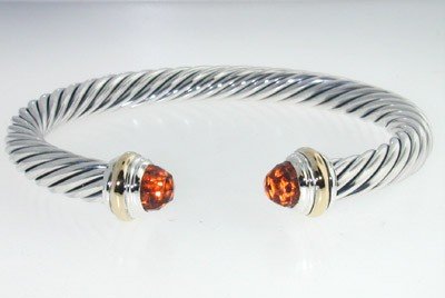 David Yurman Silver,14K Gold, Citrine Bangle.: David Yurman Silver, 14K Yellow Gold, Citrine Bangle. The total Bangle's weight is 38.5 grams. The size of citrine: 6 mm. The measurement of the inside bangle is 46 x 55 mm, Thickness: 6 mm.
