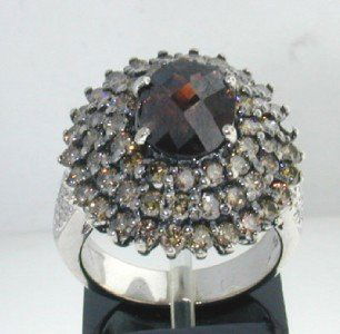 10K White Gold Champagne Diamond & Citrine Ring.: 10K White Gold Champagne Diamond & Citrine Ring. The total ring's weight is 9.5 grams. The size of center Citrine is 9 x 7 mm. Total weight of side Champagne diamond: 2.5 cts ,SI clarity. The size of