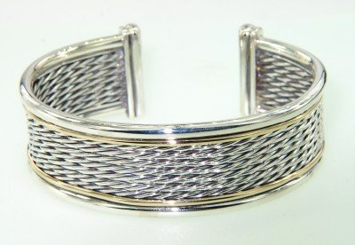 David Yurman 18K Yellow Gold & Silver Bangle: David Yurman 18K Yellow Gold & Silver Bangle Bangle's Weight : 49.5 grams. The measurements of the Bangle: 59 x 50 mm and 21 mm wide There is Stamp D.Y, 750, 925 on it.