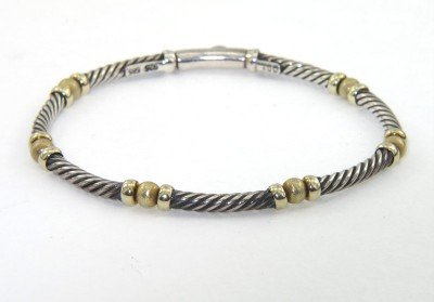 David Yurman 14K Yellow Gold & Silver Bracelet: David Yurman 14K Yellow Gold & Silver Bracelet.Bracelet's Weight : 9.7 grams.The measurements of the Bracelet: 6.75" and 2 mm wide.There is Stamp D.Y, 750, 585 on it.