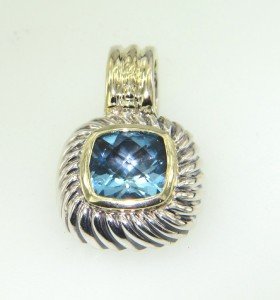 David Yurman Silver & 14K Gold Blue Topaz Pendant: David Yurman Silver & 14K Gold Blue Topaz Pendant.The total Pendant's weight is 4.9 grams.The size of the Blue Topaz is 7 x 7 mm .The size of the Pendant is 21 x 14 mm, Thickness: 5 mm.