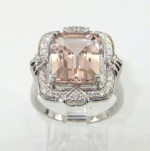 14K White Gold, Pink Topaz & Diamond Ring: 14K White Gold, Pink Topaz & Diamond Ring The total ring's weight is 7.7 grams. The total weight of Diamond: 0.44 cts approximately I color SI clarity. The size of Pink Topaz is 11 x 9 mm. The measure