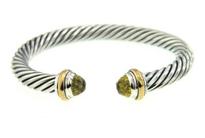David Yurman Silver,14K Gold, Lemon Citrine Bangle: David Yurman Silver, 14K Yellow Gold, Lemon Citrine Bangle.The total Bangle's weight is 38.7 grams.The size of lemon citrine: 6 mm.The measurement of the inside bangle is 53 x 44 mm, Thickness: 6 mm.