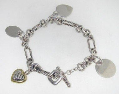 David Yurman 18K Yellow Gold / Silver Bracelet: David Yurman 18K Yellow Gold / Silver Bracelet The total bracelet's weight is 32 grams. The bracelet is 8" in length. The stamp on it is '925' '750'