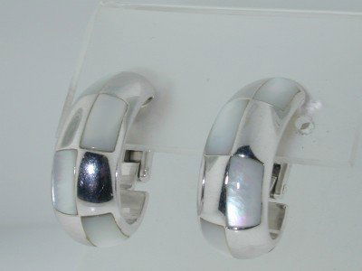 Mauboussin Paris 18K White Gold Pearl Earrings: Mauboussin Paris 18K white Gold, Mother of Pearl Earrings.The total Earrings' weight is 22.7 grams.The measurement of earrings is 25 x 9 x 16 mm.